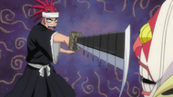 Renji angrily gives out to Dondochakka for attacking him.