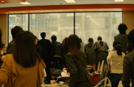 Tatsuki and her fellow students notice the commotion outside.