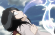 The Hollow puts its sickle in Rukia's mouth.