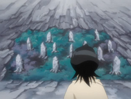 Rukia notices gravestones in the clearing.