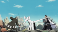 Aizen attacks Urahara with his Zanpakutō while kicking Isshin.