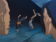 Ichigo kicks Ganju in the face.