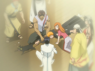 Orihime, Uryū, and Sado attempt to remove Ichigo's hand from Yoruichi's tail.