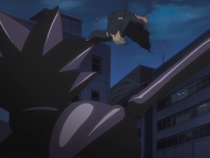 Izuru leaps over Dalk to evade her machine gun fire.