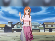 Orihime waves goodbye as she stays behind to heal Jidanbō again.