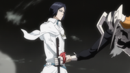 Uryū prevents Zangetsu from carving up Ulquiorra's corpse.