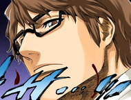 Aizen stares coldly at Hinamori after revealing his true nature.