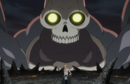 A Kushanāda looms behind Ichigo as his Hollowfied form disappears.