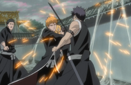 Ichigo blocks Hisagi's attack as he fends off the Shinigami.