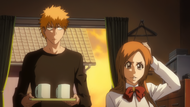 Orihime fidgets in Ichigo's bedroom.