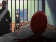 Hinamori watches as a member of the Fourth Division finishes treating Renji.