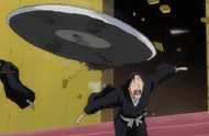 Aida dodges Kibune's attack.