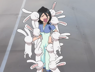 Rukia is accosted by several rabbits shaped like her drawings.