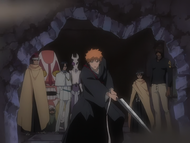 Renji watches as Ichigo destroys a door leading to the new building.