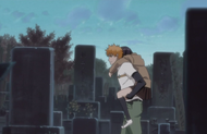 Ichigo carries Senna through a graveyard.