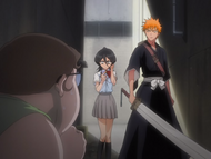 Rukia and Ichigo find the Fat Ghost in an alleyway.