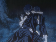 Rukia clutches Kaien's corpse.