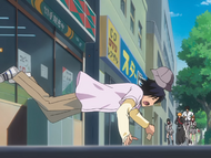 Hanatarō is thrown out into the street in front of Rukia and her friends.