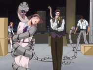 Orihime watches as Utagawa holds the woman hostage with one of his snakes.