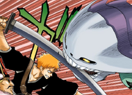 Ichigo intercepts the Demi-Hollow's attack.