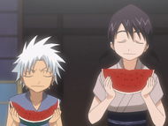 Hinamori and Hitsugaya eat watermelon.