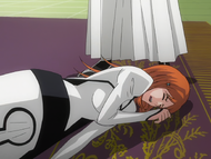 Orihime is thrown to the ground by Loly.