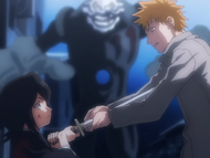 A wounded Rukia about to give Ichigo her power.