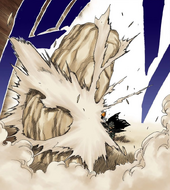 Urahara attacks Ichigo, breaking a large rock behind him.