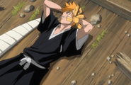 Kon kicks Ichigo in the face.