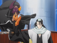 Yoruichi balances herself on Byakuya's arm while carrying Ichigo.