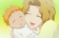 Masaki cuddles baby Ichigo.