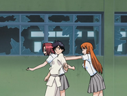 Orihime pushes Chizuru and Tatsuki.