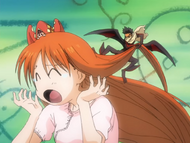 Tsubaki pulls on Orihime's hair to punish her.