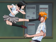 Ichigo is kicked in the face by Rukia.