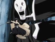 Rukia decapitates two Menos Grande with a single slash.