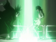 Renji slashes his sword in front of Rukia.