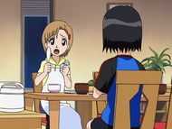 Yuzu yells at Ichigo and Isshin to behave and sit down for dinner.