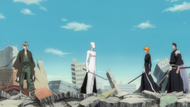 Aizen appears in the midst of Ichigo, Isshin, and Urahara.