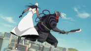 Komamura attacks Tōsen with his Bankai.