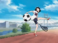 Karin angrily kicks the soccer ball away.