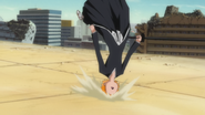 Ichigo is sent flying back from the attack.