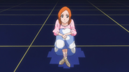 Orihime watches the training.