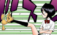 Rukia stomps on an overjoyed Kon.