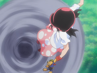 Ururu leaps out of the vortex with Kon.