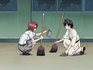 Chizuru and Tatsuki Arisawa clean up the broken glass.