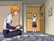 Yuzu Kurosaki looks for her pajamas in Ichigo's room.