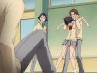 Keigo restrains Tatsuki after she punches Ichigo.