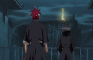 Rukia and Renji watch the preparation of the Kidō Cannon from afar.