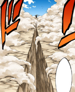 Ichigo stands at the end of a deep fissure left by his attack.