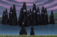 Ichigo and Rukia look at the Gillians in the center of the lake.